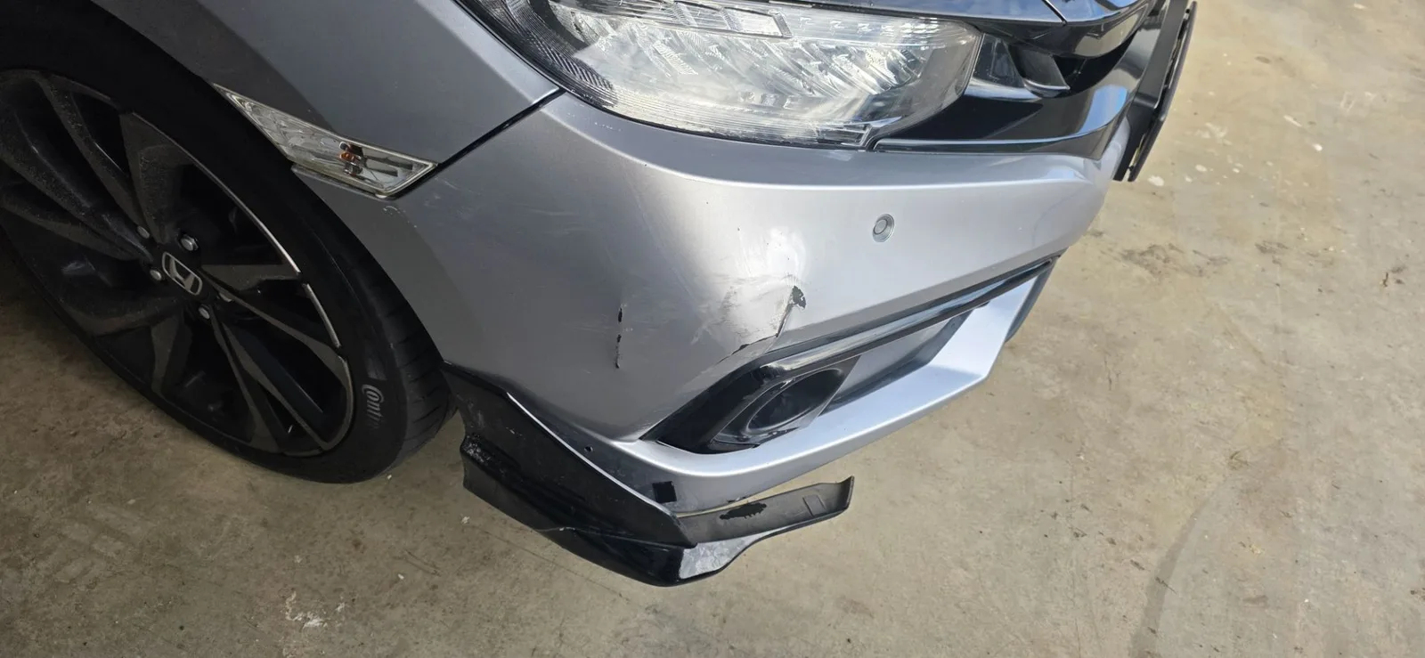 Car damage before repair - Scratched front bumper on a 2020 Honda Civic repaired in Mickleham before professional scratch repair service