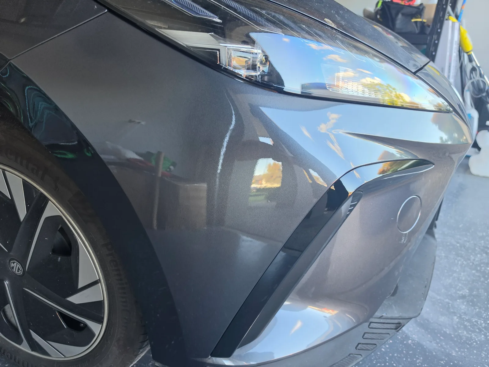 Scratched front bumper and moulding on an MG repaired in South Morang — after