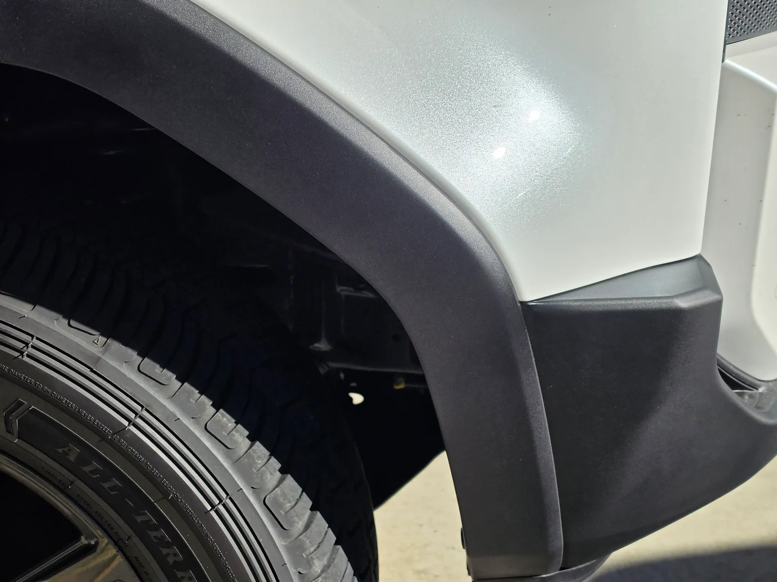 Professional car repair result - Scratched wheel-arch moulding on a new LandCruiser repaired and repainted in Wollert after expert repair by Melbourne Scratch Repairs
