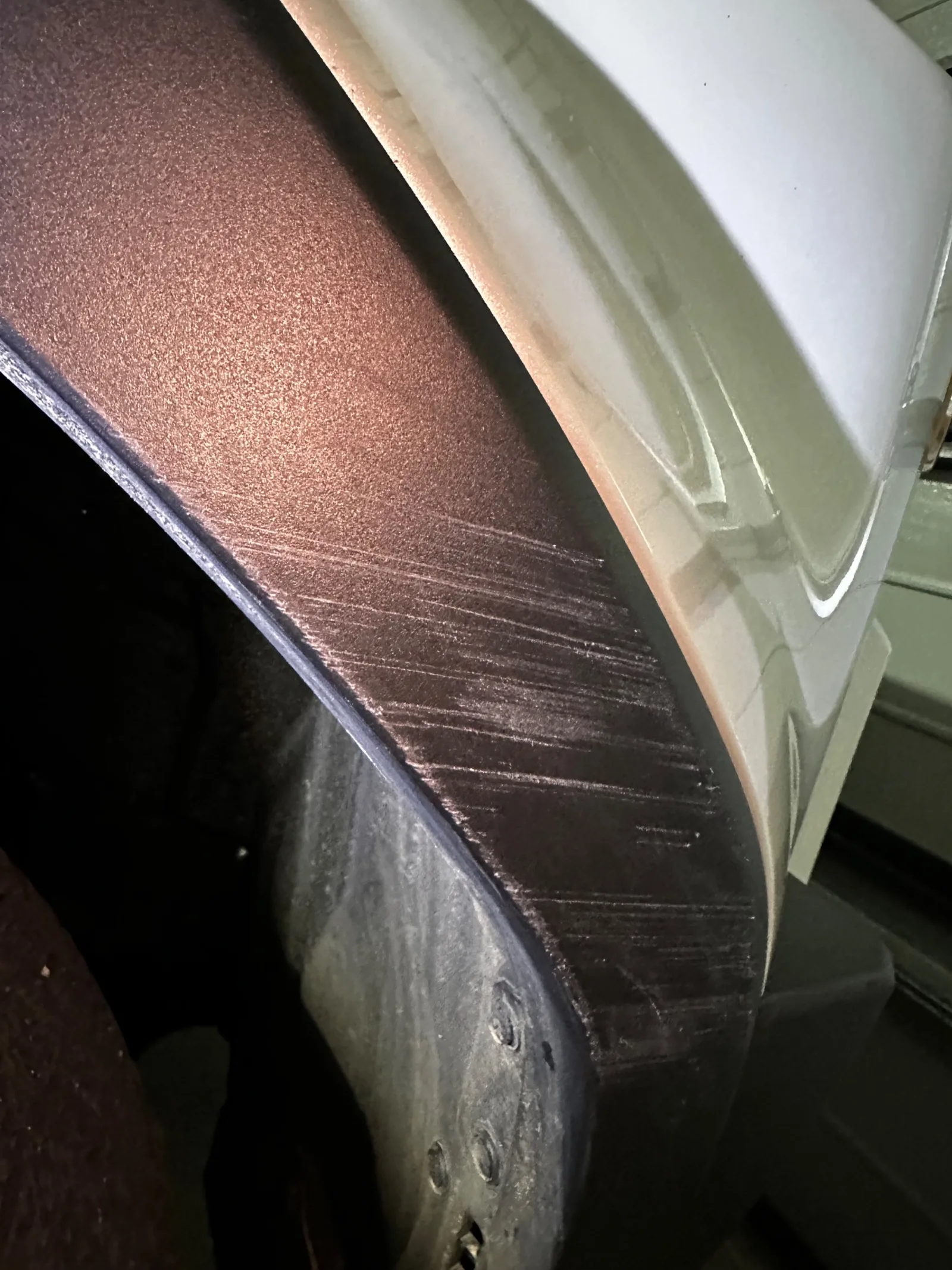 Car damage before repair - Scratched wheel-arch moulding on a new LandCruiser repaired and repainted in Wollert before professional scratch repair service